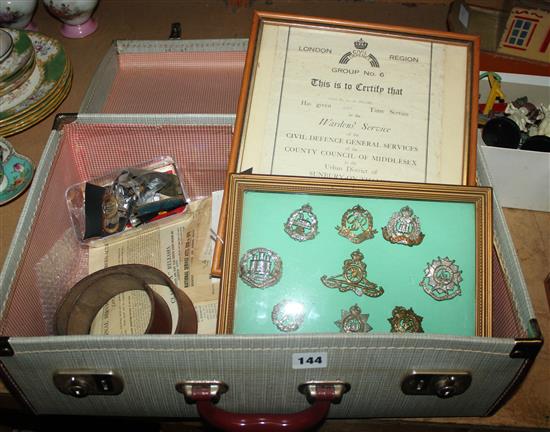A collection of World War II memorabilla, various badges etc